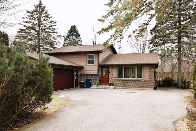 split level home with a garage