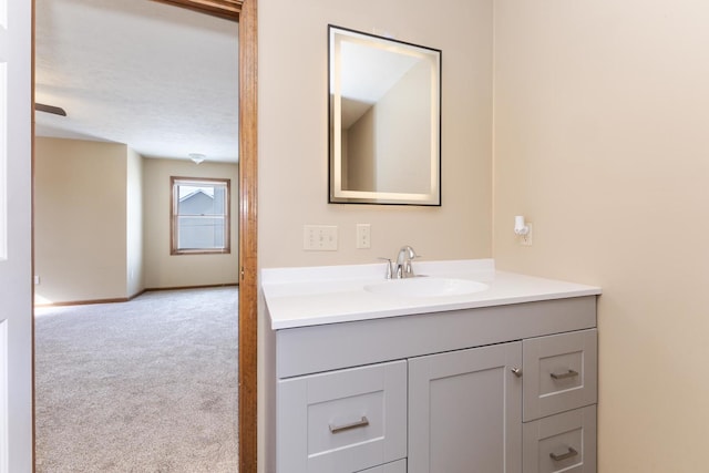 bathroom with baseboards and vanity