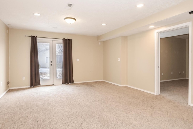 empty room with recessed lighting, baseboards, and light colored carpet