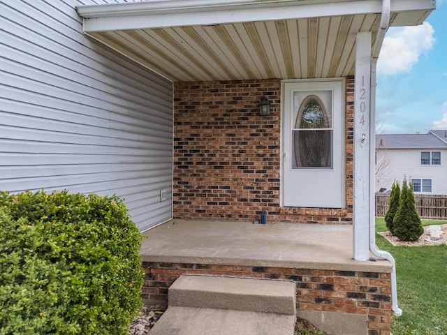 entrance to property with brick siding
