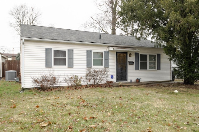 ranch-style home with central AC and a front yard