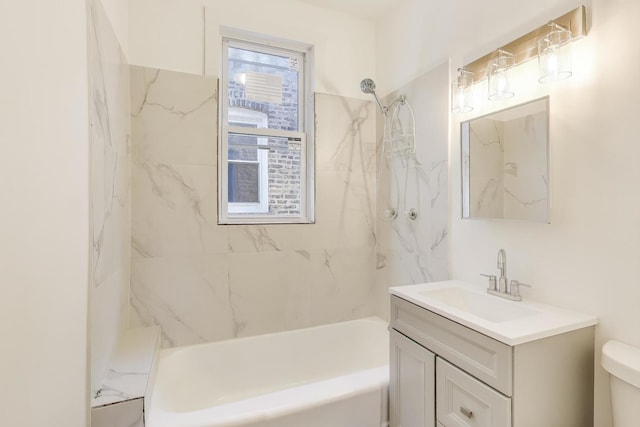 full bathroom featuring vanity, toilet, and tiled shower / bath combo