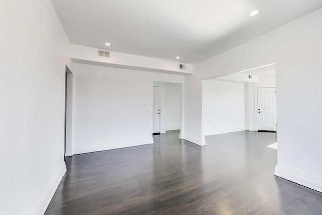 empty room featuring dark hardwood / wood-style flooring