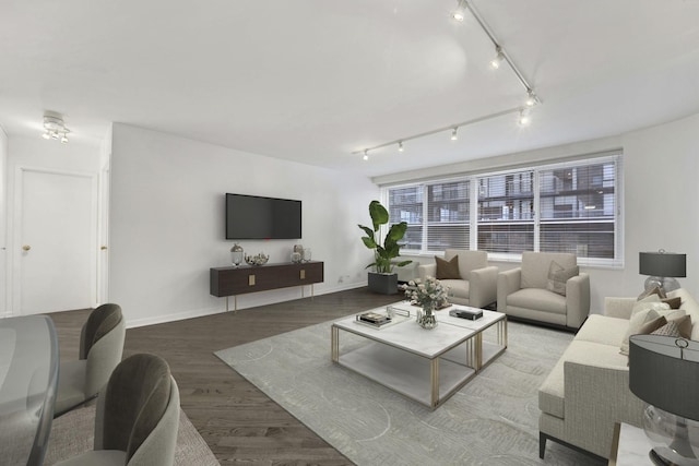 living room with baseboards and wood finished floors