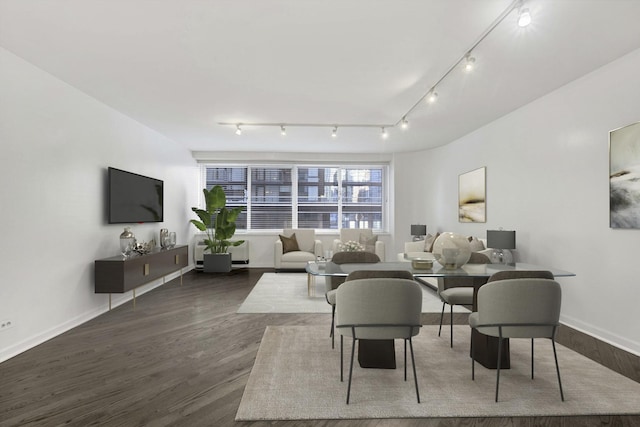 living area with baseboards and dark wood-style flooring