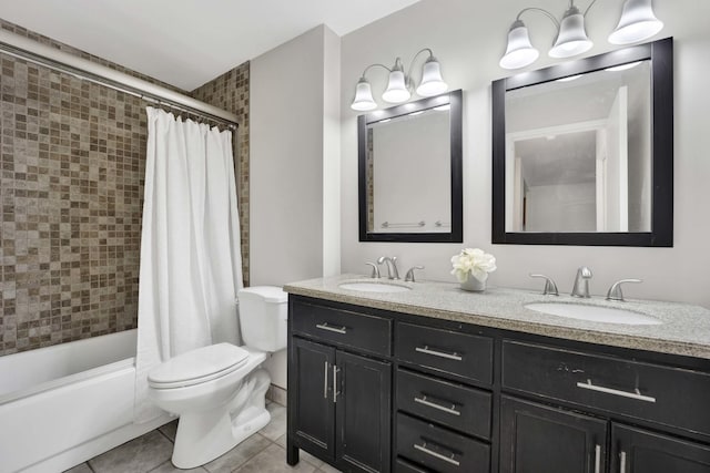 full bathroom featuring tile patterned flooring, a sink, toilet, and double vanity