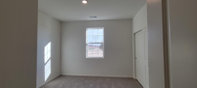 unfurnished room with carpet flooring