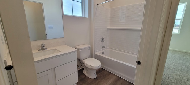 full bathroom with bathing tub / shower combination, hardwood / wood-style floors, vanity, and toilet