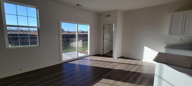 unfurnished dining area with hardwood / wood-style flooring