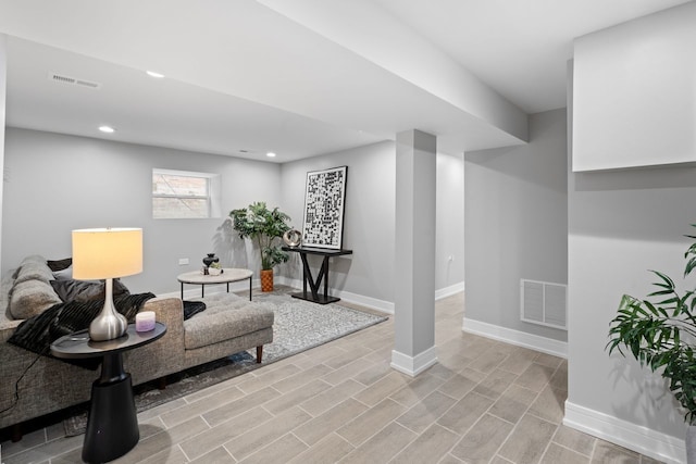 living area with light hardwood / wood-style flooring