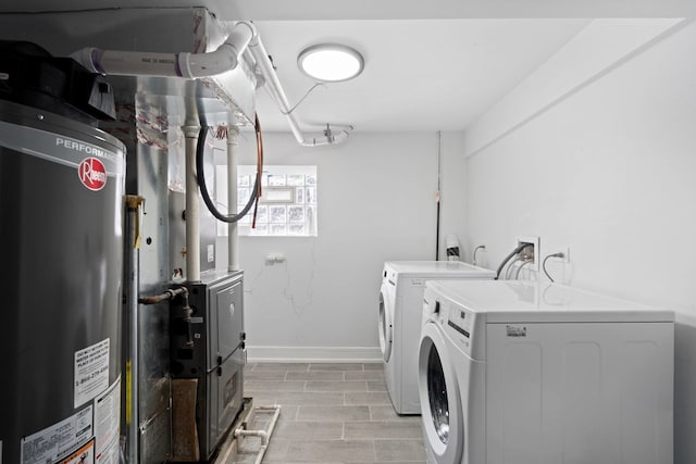 laundry room featuring washer and clothes dryer and gas water heater