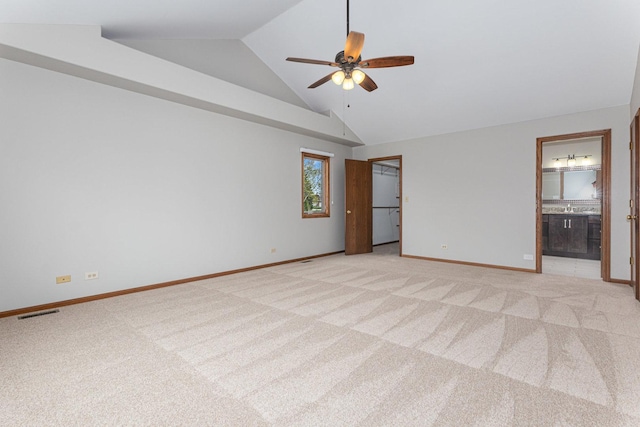 unfurnished bedroom with baseboards, visible vents, ensuite bathroom, and light colored carpet