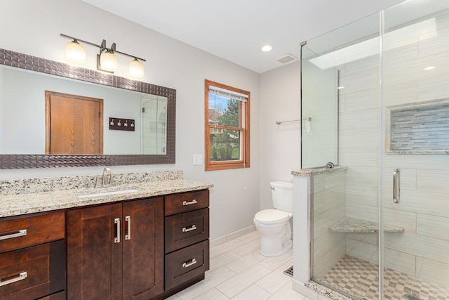full bath featuring toilet, visible vents, vanity, and a stall shower