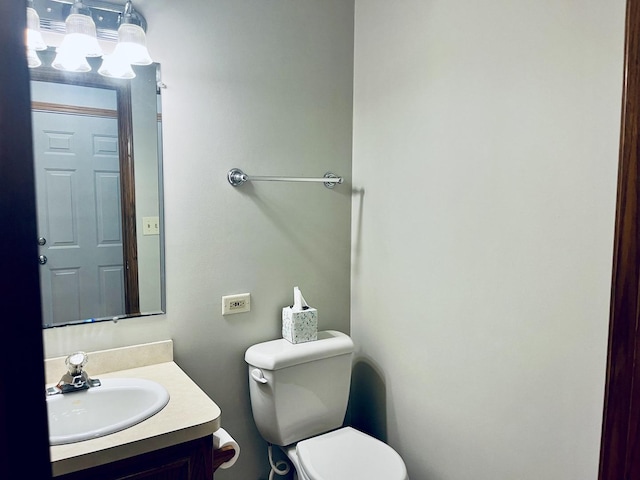 bathroom with toilet and vanity