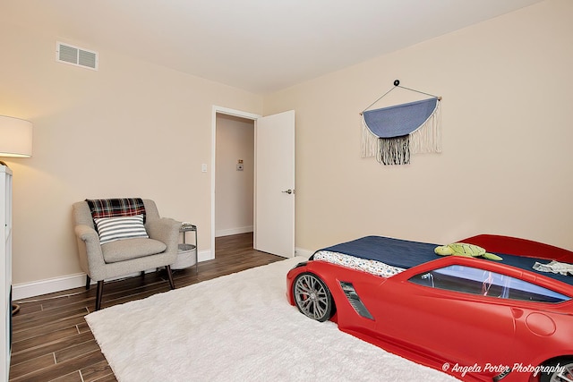 bedroom featuring dark wood-type flooring