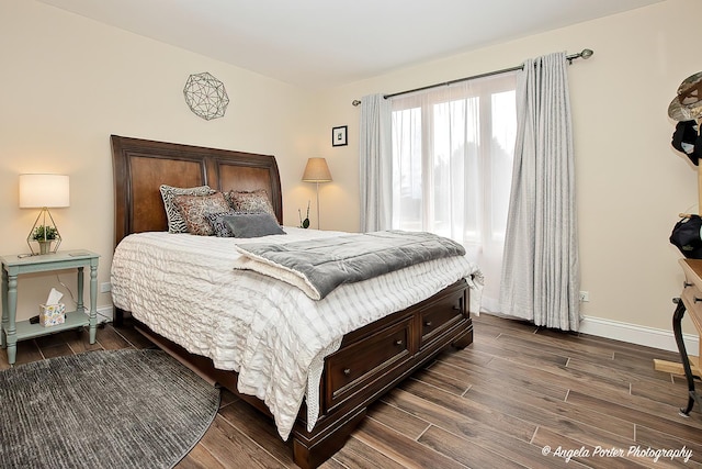 bedroom featuring dark hardwood / wood-style flooring