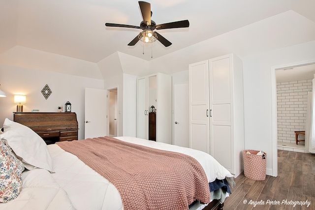 bedroom featuring ensuite bath, dark wood-type flooring, and ceiling fan