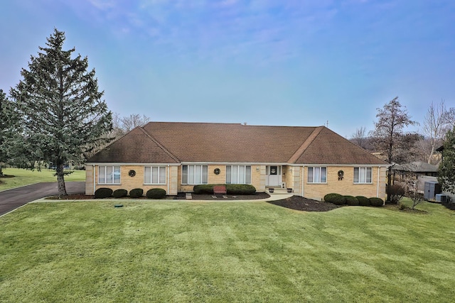 ranch-style home with a front yard