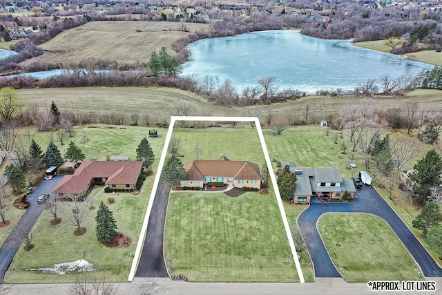 drone / aerial view featuring a water view and a rural view