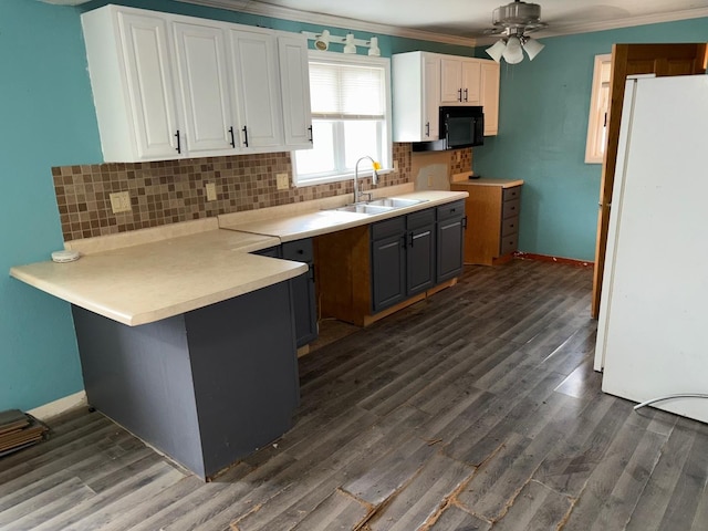 kitchen with sink, white cabinetry, white refrigerator, tasteful backsplash, and ornamental molding