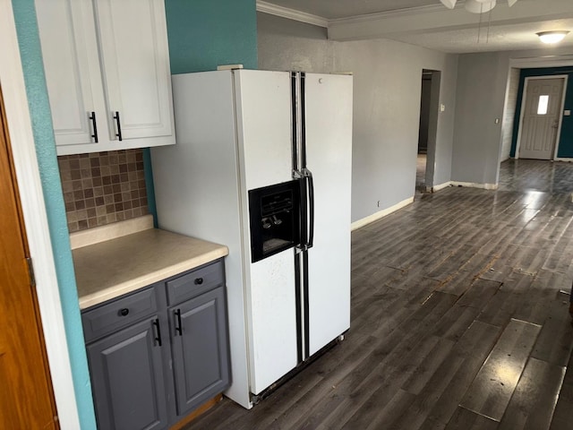 kitchen with dark wood-type flooring, gray cabinetry, tasteful backsplash, white refrigerator with ice dispenser, and white cabinets