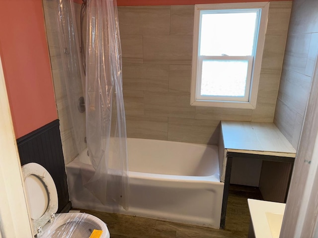 full bathroom featuring shower / bathtub combination with curtain, vanity, and toilet