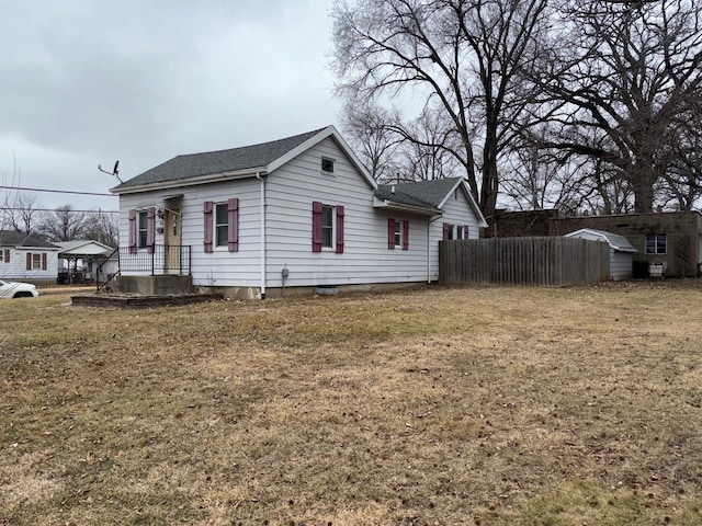 view of side of home featuring a lawn