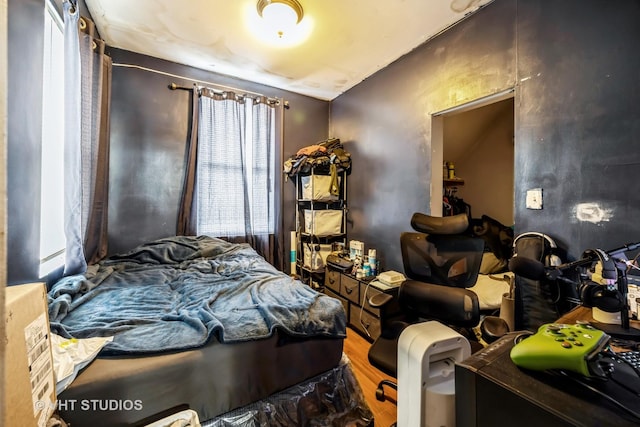 bedroom featuring wood-type flooring