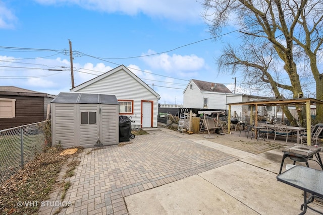 view of patio / terrace featuring a storage shed