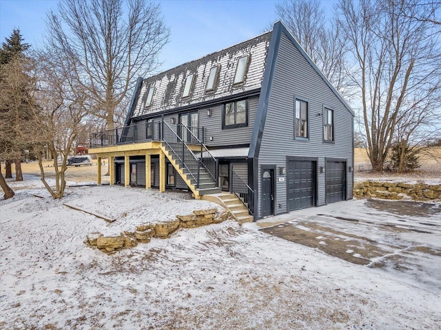 exterior space with a garage and a deck