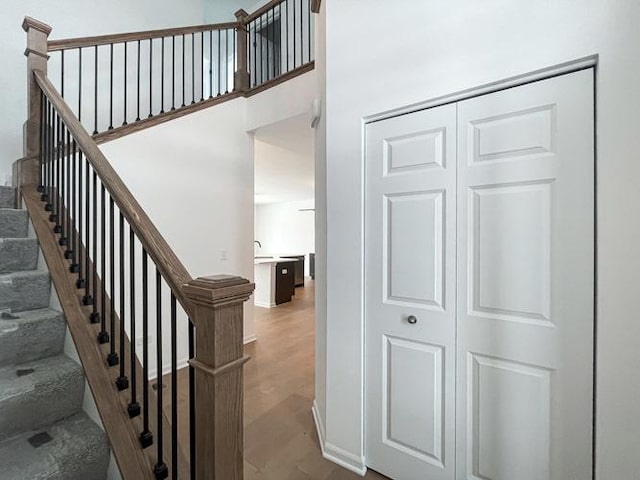 stairway featuring hardwood / wood-style flooring