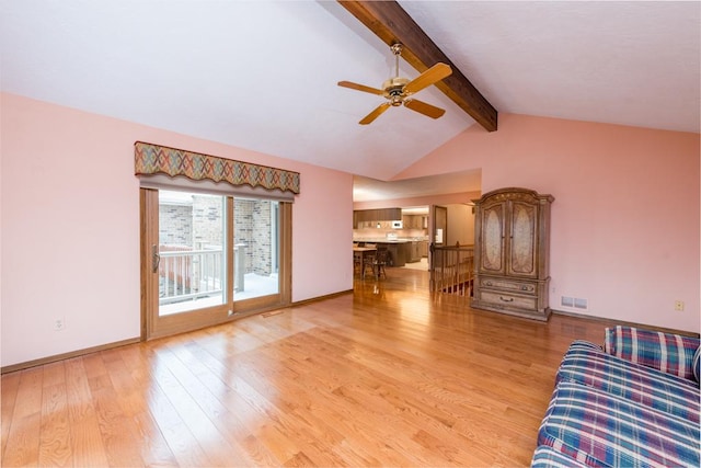 unfurnished living room with ceiling fan, lofted ceiling with beams, and light hardwood / wood-style flooring