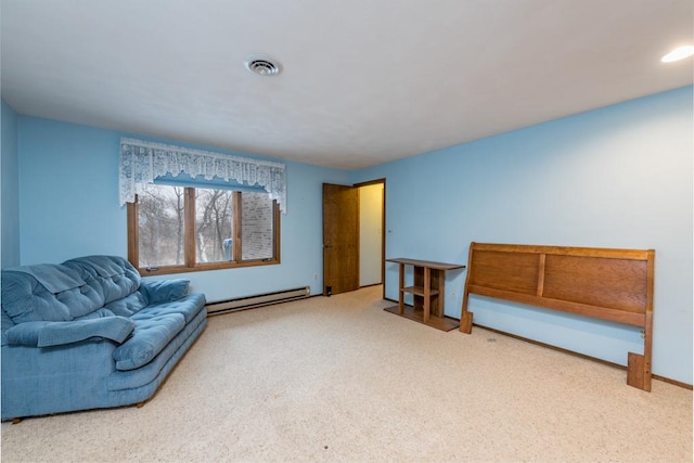 sitting room with carpet flooring and baseboard heating