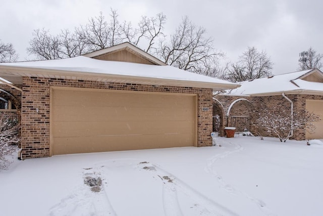 view of snow covered garage