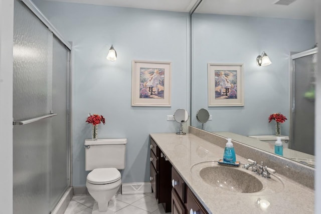 full bath with tile patterned flooring, toilet, vanity, baseboards, and a stall shower