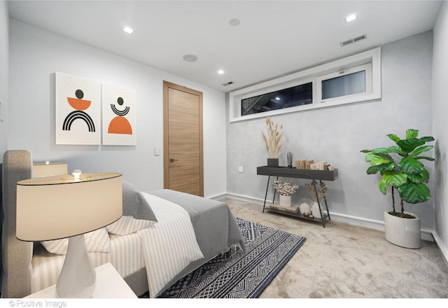 bedroom featuring light colored carpet