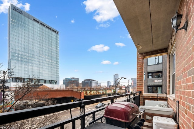 balcony with grilling area and a city view