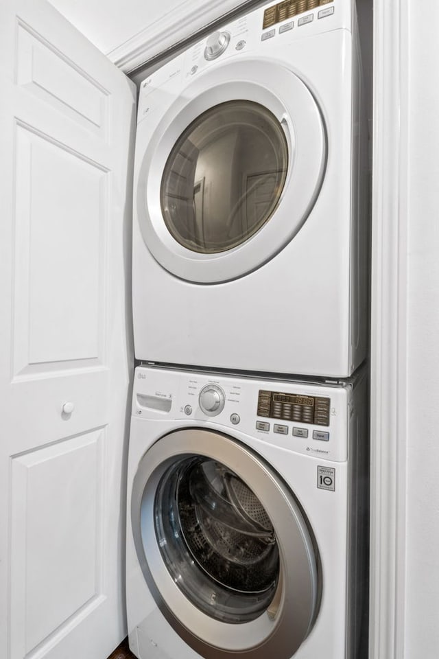 laundry area featuring laundry area and stacked washing maching and dryer