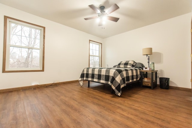 bedroom with wood-type flooring and ceiling fan