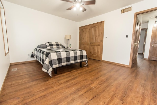 bedroom with wood-type flooring and ceiling fan