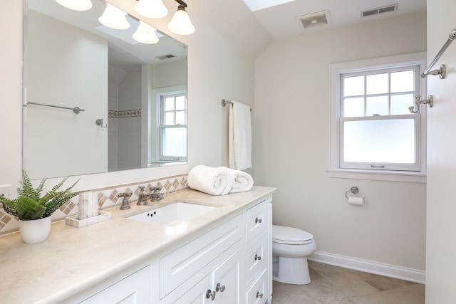 bathroom featuring visible vents, vanity, and toilet