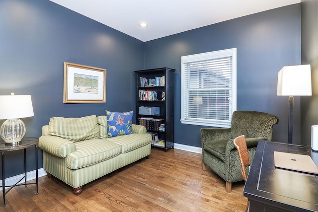 interior space featuring baseboards and wood finished floors