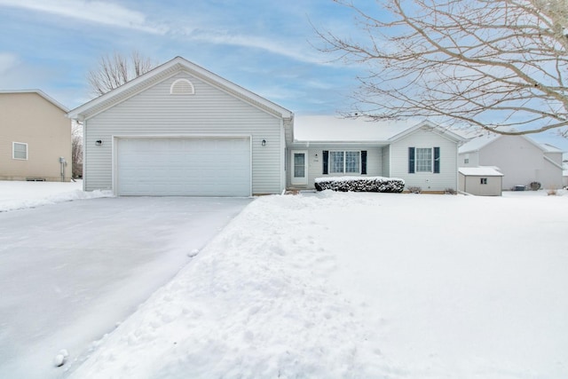 ranch-style house featuring an attached garage and driveway