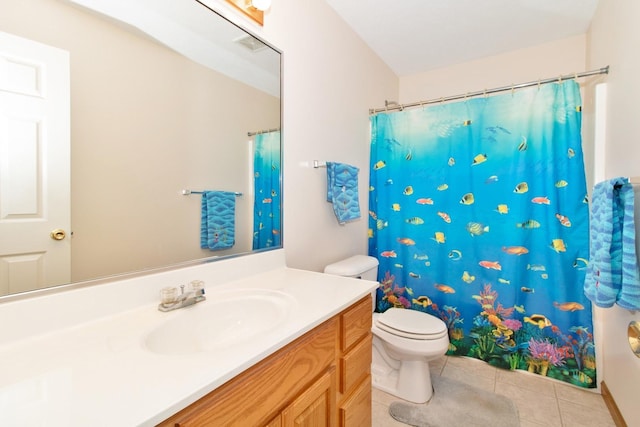 bathroom featuring tile patterned flooring, a shower with shower curtain, vanity, and toilet