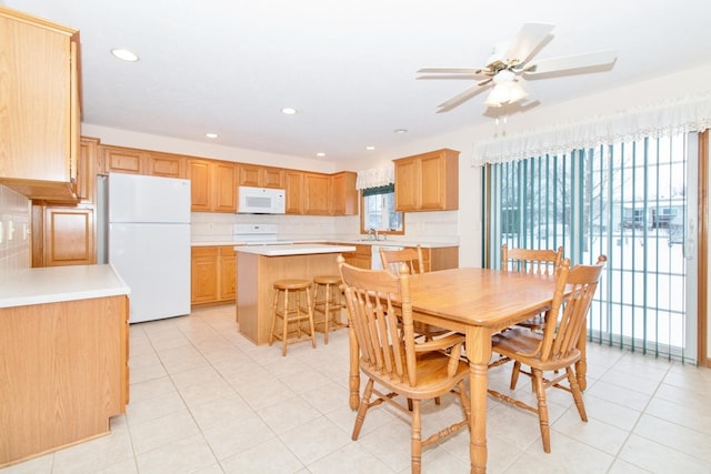 dining room featuring light tile patterned floors, a ceiling fan, and recessed lighting