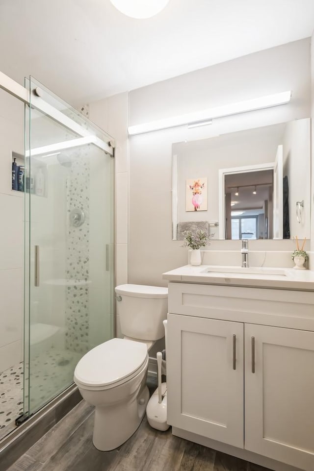 400 E Randolph St Unit 2410, Chicago, IL 60601 - full bathroom with wood finished floors, toilet, a shower stall, and vanity