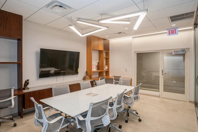 office area with a paneled ceiling