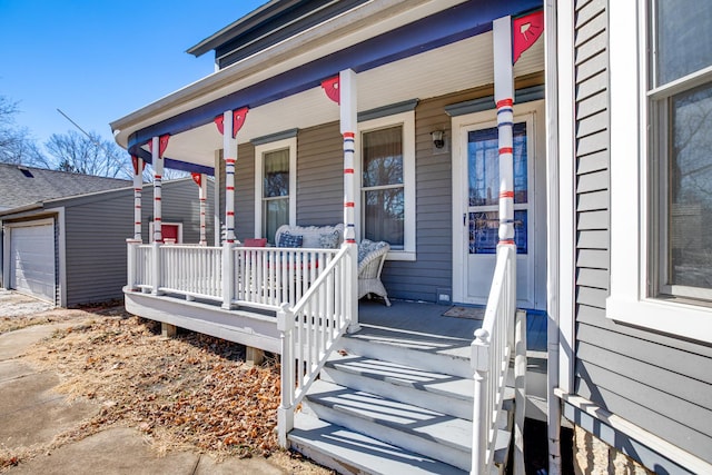 doorway to property featuring a porch and a garage