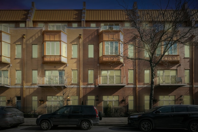 view of outdoor building at dusk