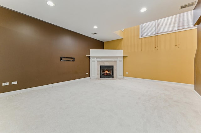 unfurnished living room featuring carpet flooring